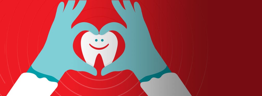 hands making heart shape around tooth